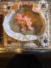 Grilled crab meat and tomalley in shell